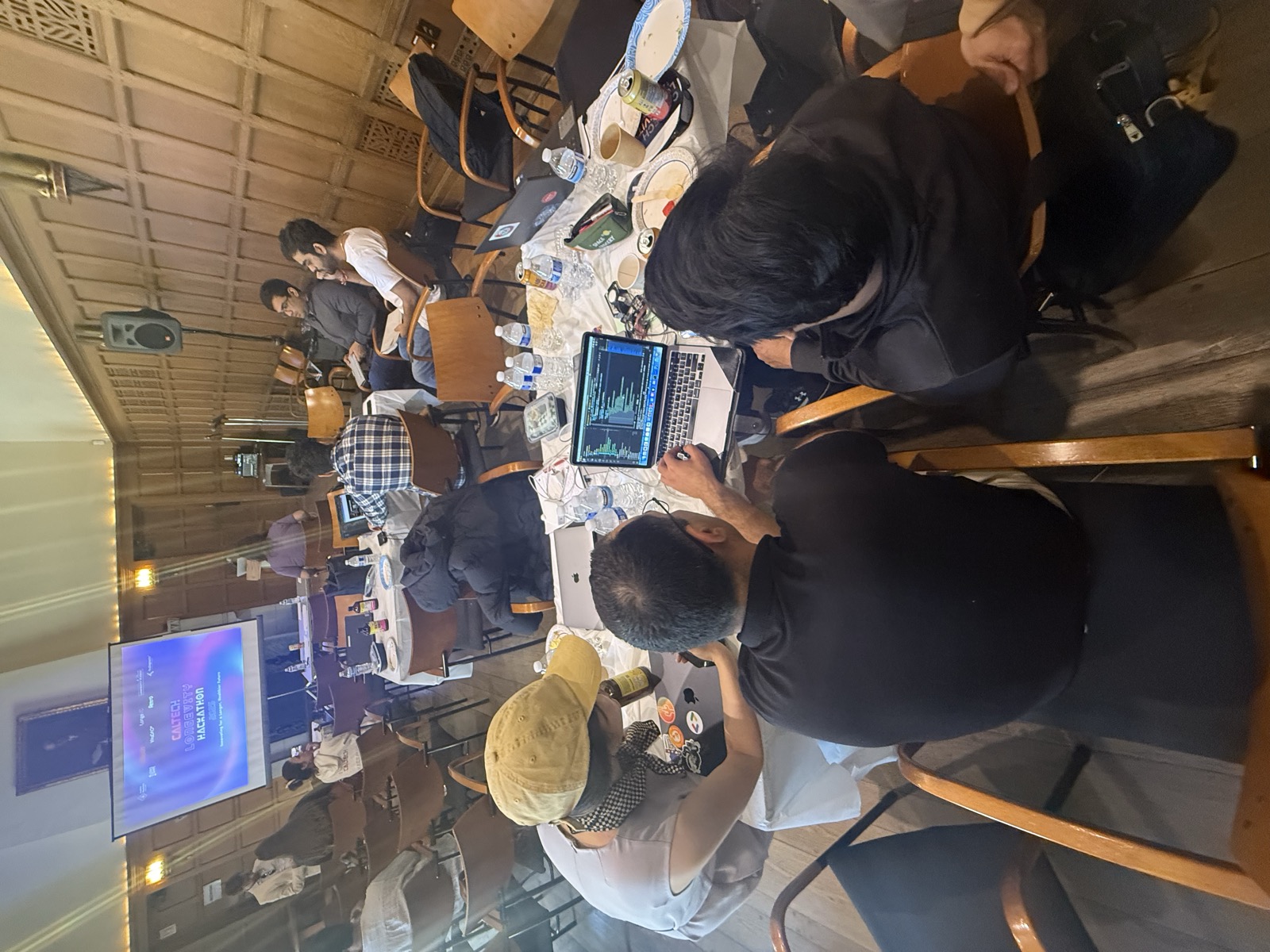 Teams deep in code during the hackathon